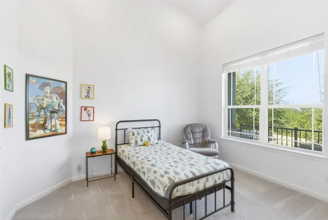 a spacious bathroom with a granite countertop tub sink and mirror