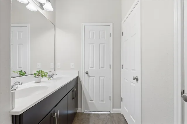 a living room with a baby crib furniture and a window