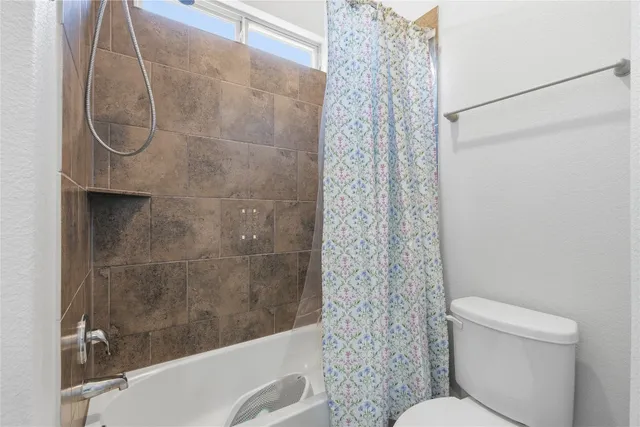 a bathroom with a sink a mirror and a shower