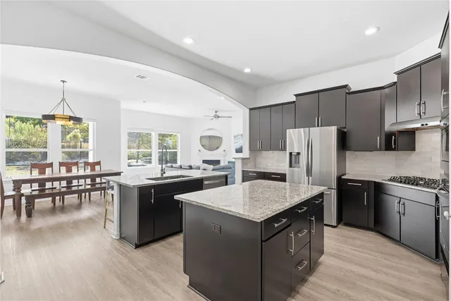an aerial view of a house with a swimming pool