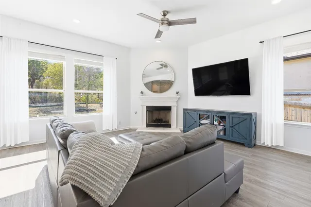 a kitchen with kitchen island granite countertop a sink stove and refrigerator