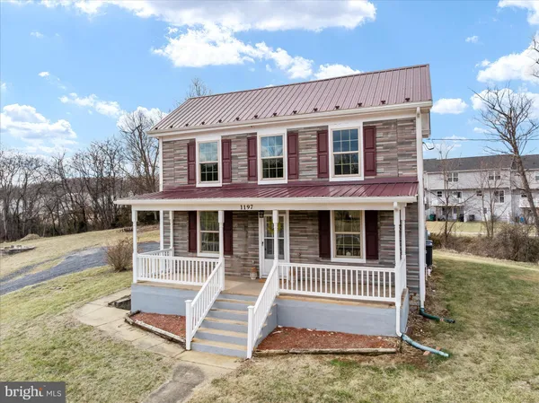 a front view of a house with a porch