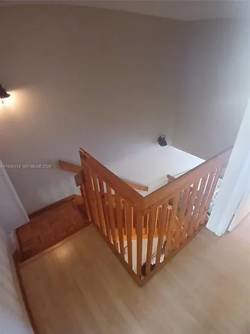 a view of a hallway with staircase