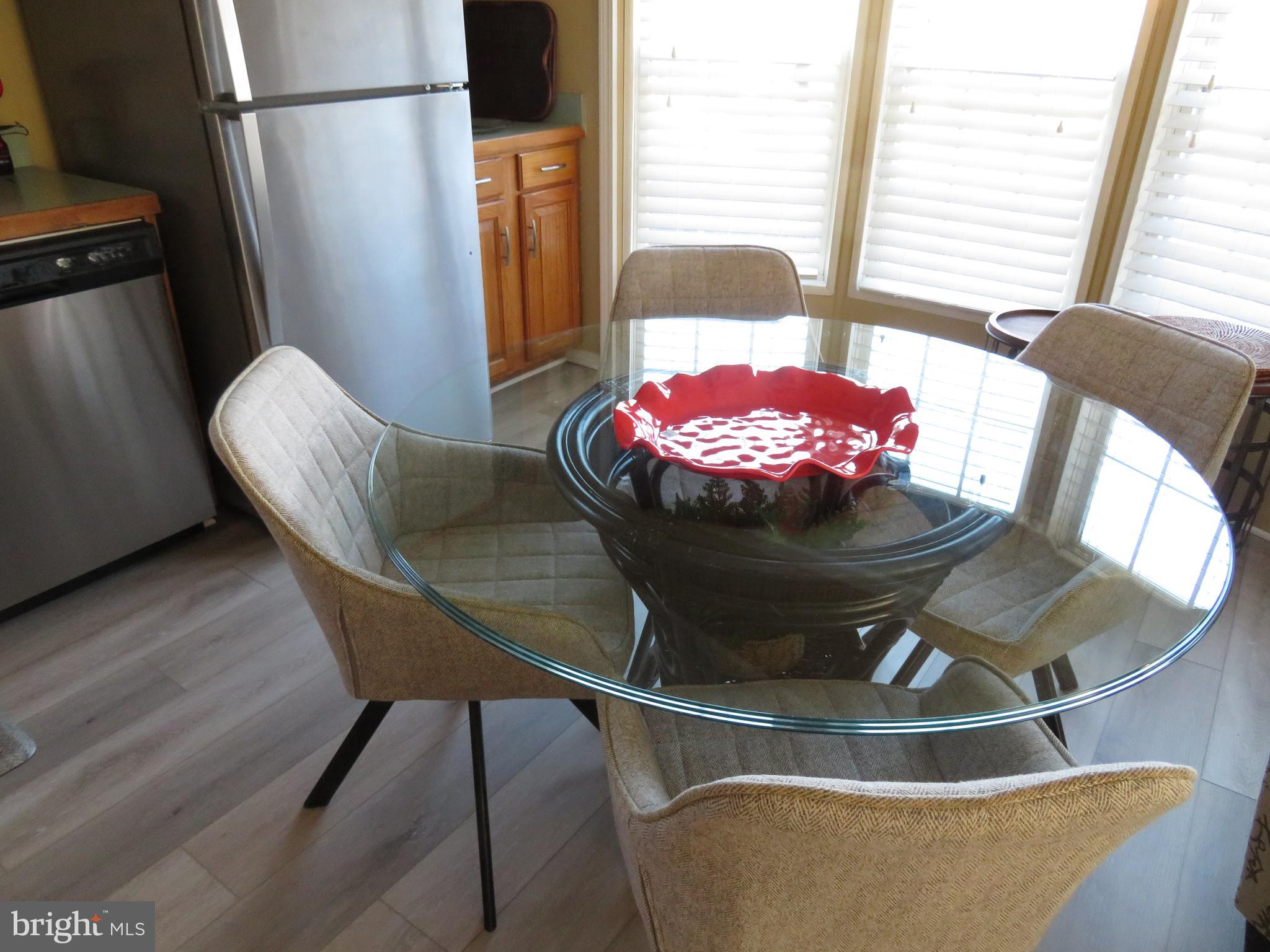 120 Skipjack Circle Berlin, MD 21811 - Photo 15 of 91 a view of a dining room with furniture and wooden floor