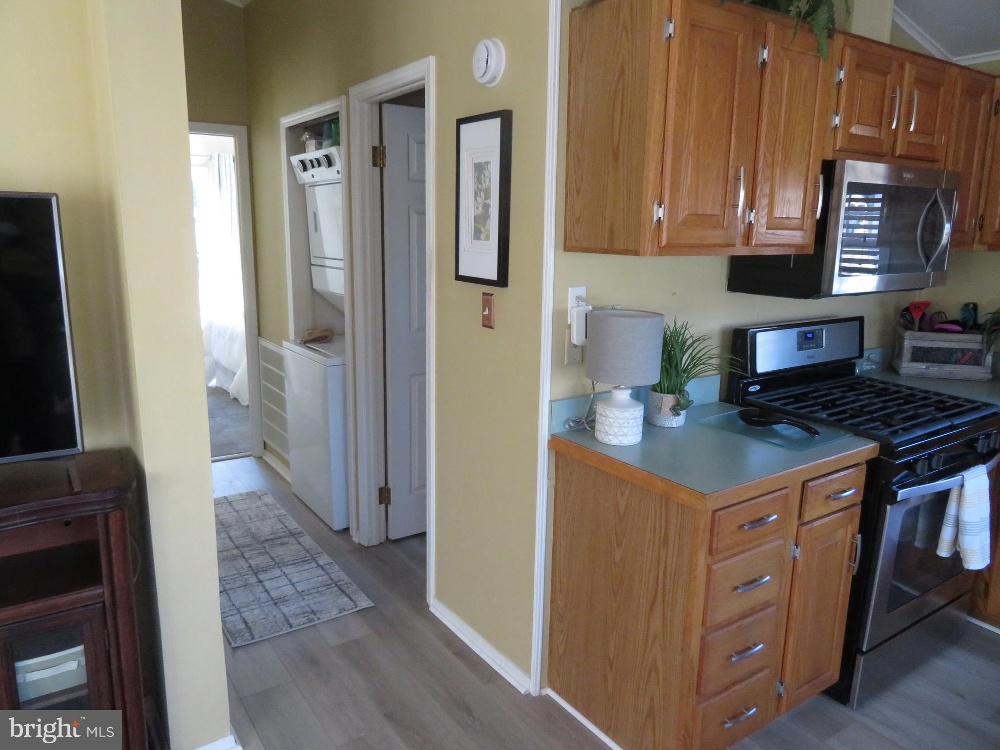 120 Skipjack Circle Berlin, MD 21811 - Photo 23 of 91 a kitchen with stainless steel appliances granite countertop a refrigerator and a stove top oven