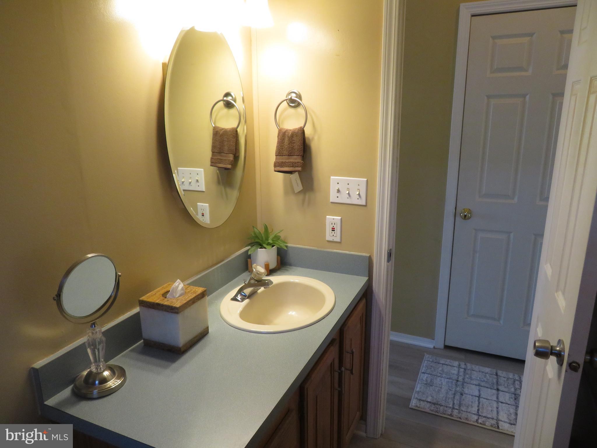 120 Skipjack Circle Berlin, MD 21811 - Photo 27 of 91 a bathroom with a sink vanity and a mirror