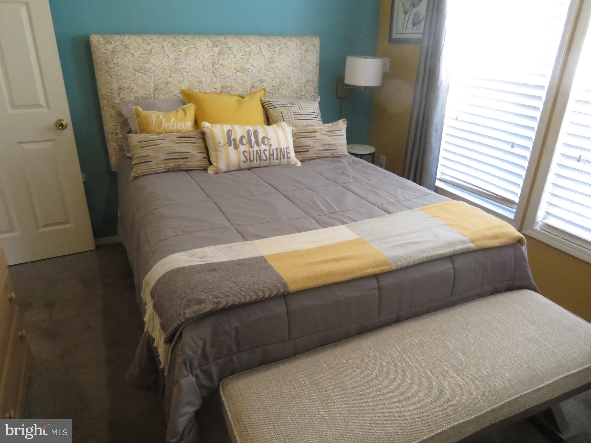 120 Skipjack Circle Berlin, MD 21811 - Photo 38 of 91 a bed sitting in a bedroom next to a window