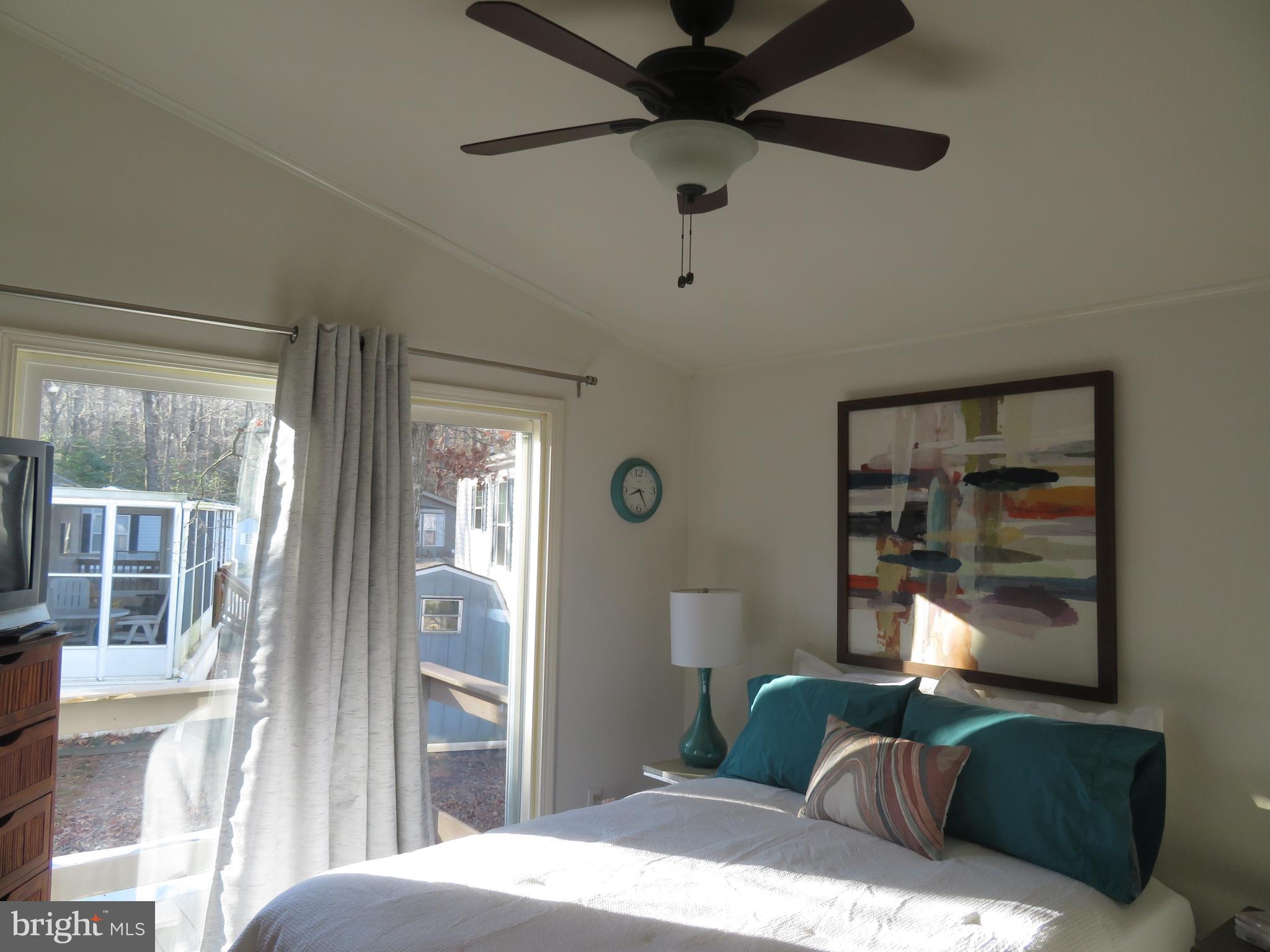 120 Skipjack Circle Berlin, MD 21811 - Photo 44 of 91 a bedroom with a bed and glass window