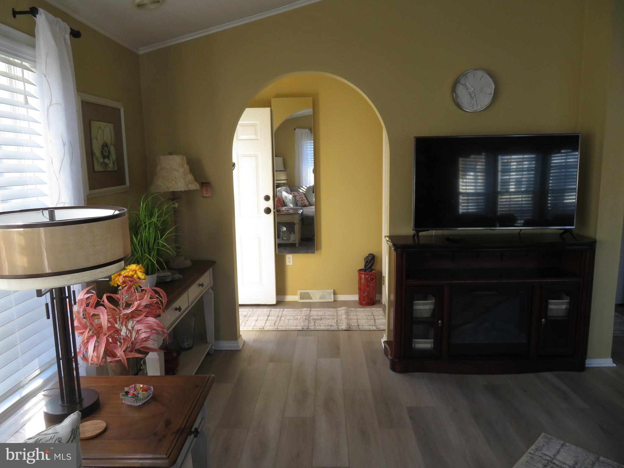 120 Skipjack Circle Berlin, MD 21811 - Photo 7 of 91 a living room with furniture and a fireplace