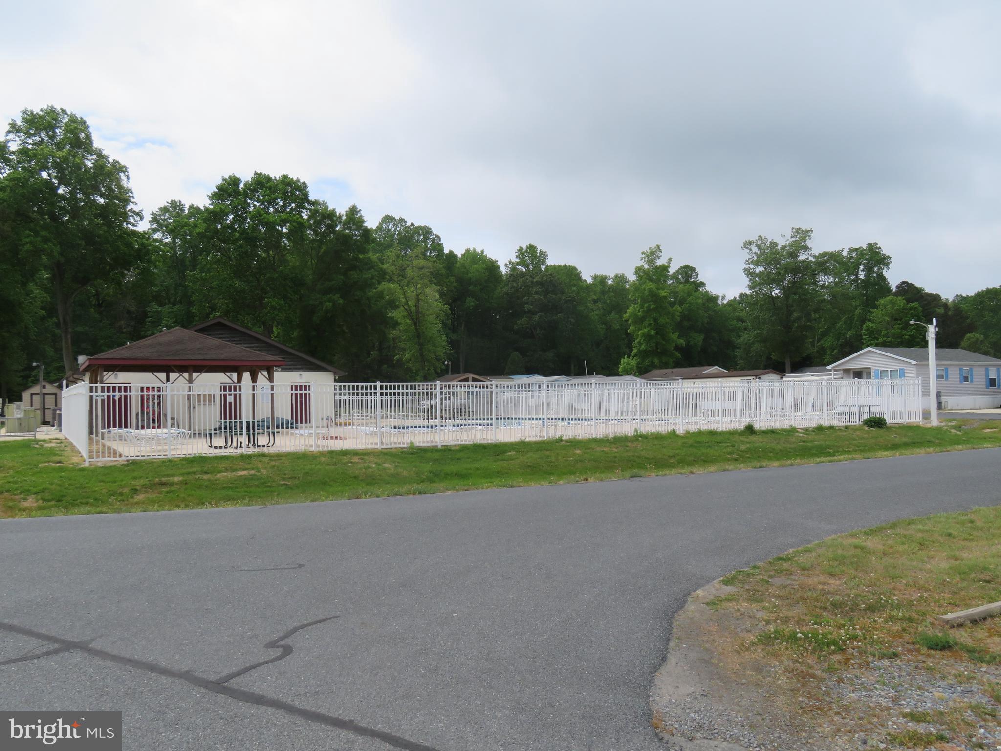 120 Skipjack Circle Berlin, MD 21811 - Photo 81 of 91 a view of a house with a yard and a large tree