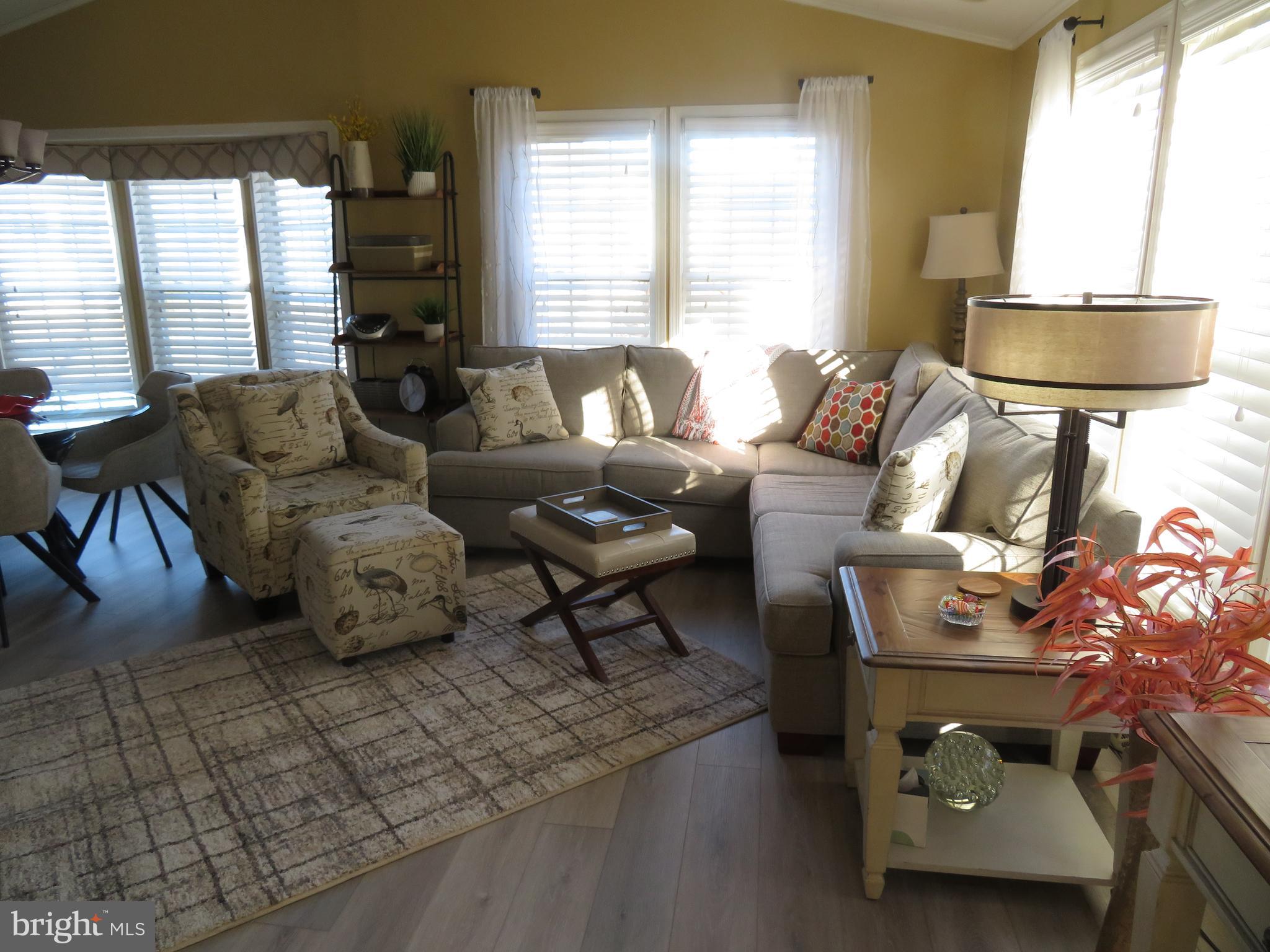 120 Skipjack Circle Berlin, MD 21811 - Photo 9 of 91 a living room with furniture and a large window