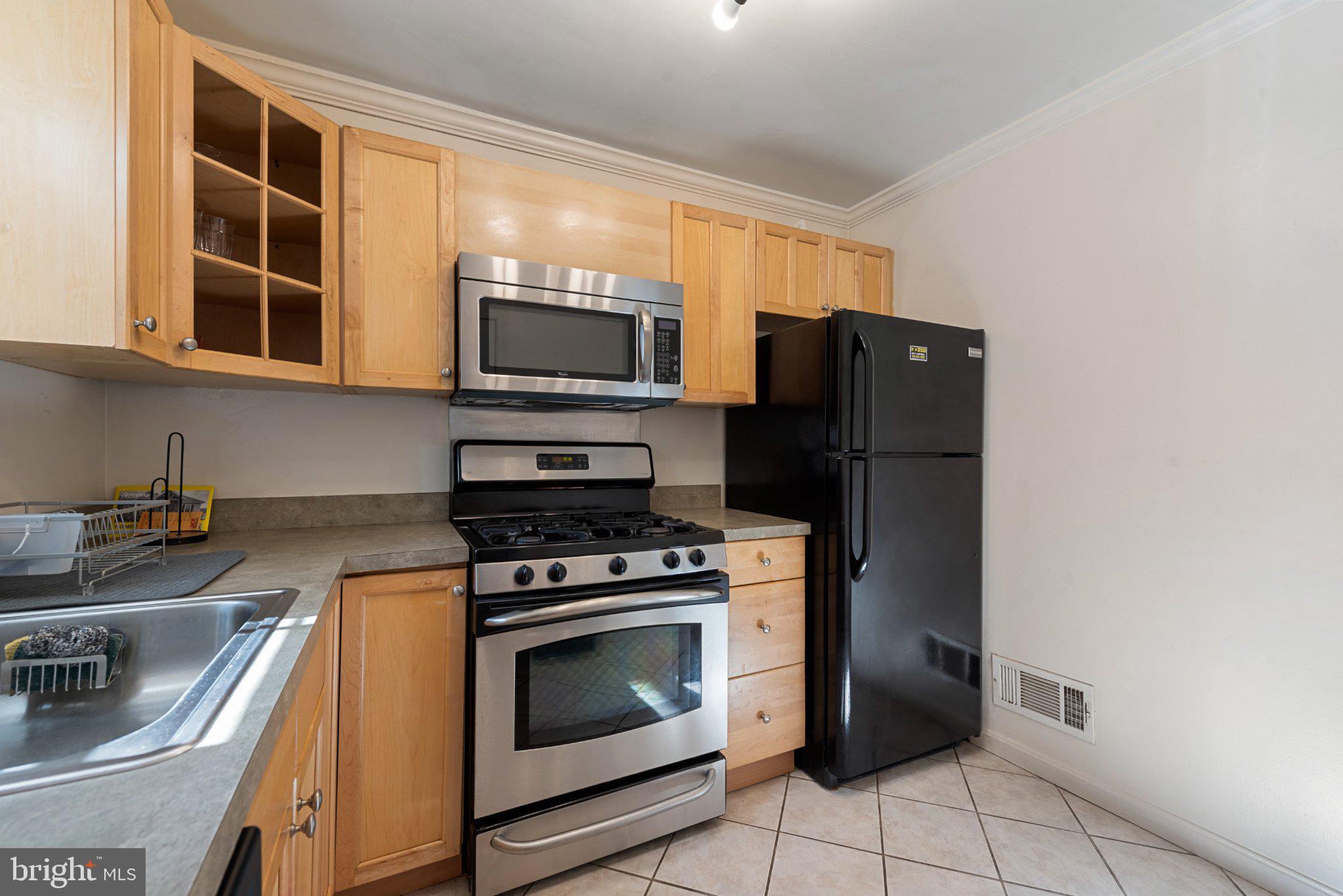 211 South Madeira Street Baltimore, MD 21231 - Photo 10 of 18 Modern kitchen with sleek appliances.