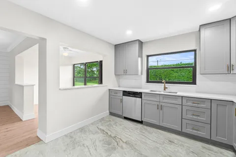 a bathroom with a toilet sink and shower