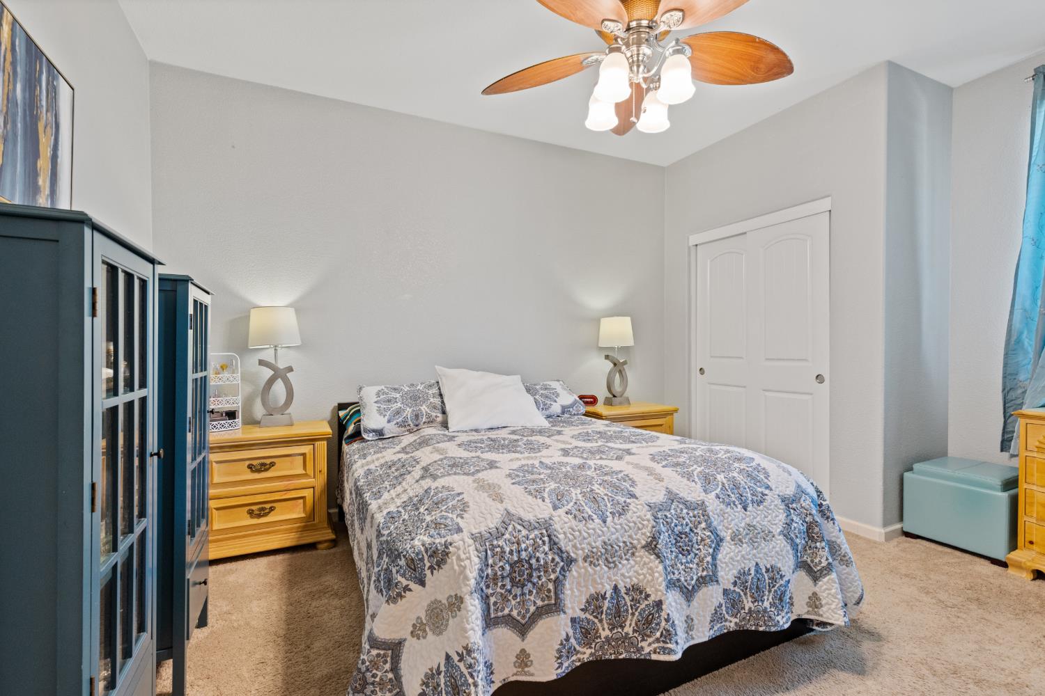 2011 Roy Ranch Way Plumas Lake, CA 95961 - Photo 18 of 49 a bedroom with a bed and a chandelier
