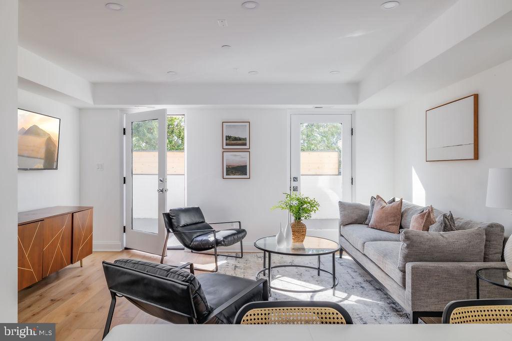 1200 Eton Court Northwest Washington, DC 20007 - Photo 16 of 66 a living room with furniture fireplace and a window