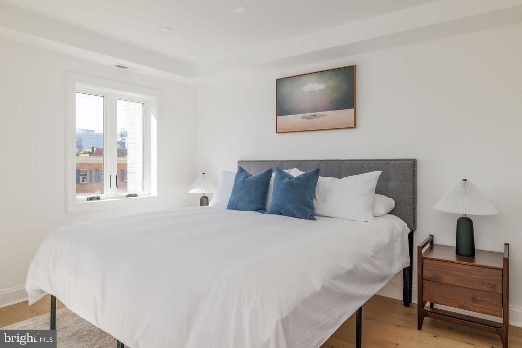 1200 Eton Court Northwest Washington, DC 20007 - Photo 30 of 66 a bedroom with a bed and a chair