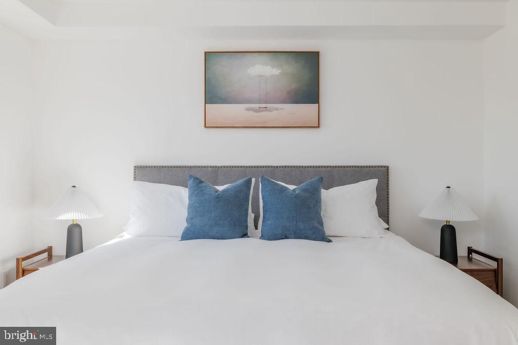 1200 Eton Court Northwest Washington, DC 20007 - Photo 31 of 66 a bedroom with a bed and a lamp