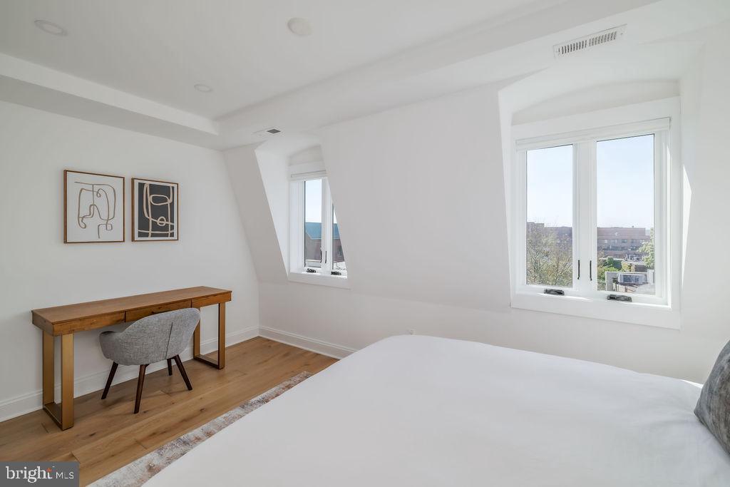 1200 Eton Court Northwest Washington, DC 20007 - Photo 51 of 66 a bedroom with a bed and a window