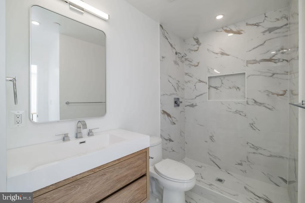 1200 Eton Court Northwest Washington, DC 20007 - Photo 55 of 66 a bathroom with a sink toilet vanity and shower
