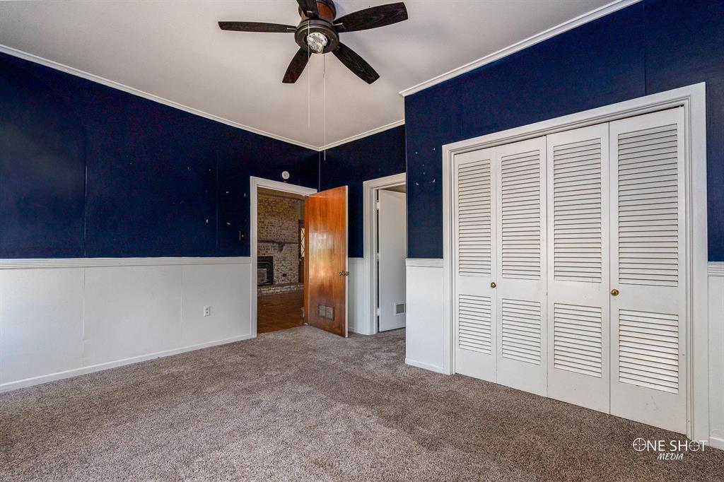 3741 Caldwell Road Abilene, TX 79601 - Photo 22 of 36 Unfurnished bedroom featuring ornamental molding, a closet, ceiling fan, and carpet flooring