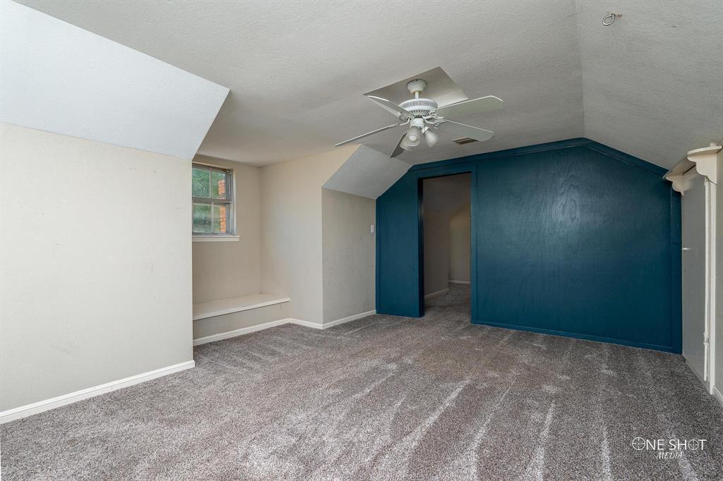 3741 Caldwell Road Abilene, TX 79601 - Photo 26 of 36 Bonus room with ceiling fan, carpet flooring, a textured ceiling, and vaulted ceiling