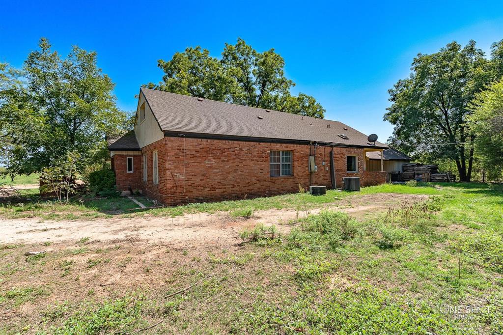 3741 Caldwell Road Abilene, TX 79601 - Photo 35 of 36 Rear view of property featuring central AC