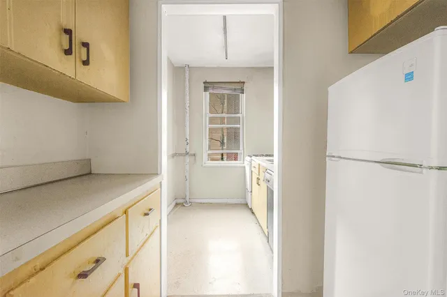 a view of walk in closet with white walls