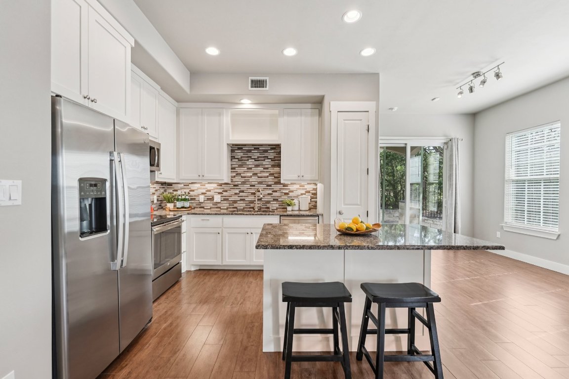 4301 Mansfield Dam Road, Unit 2101 Austin, TX 78734 - Photo 5 of 15 Modern meets functional — cook, connect, and entertain with ease in this sleek kitchen.
