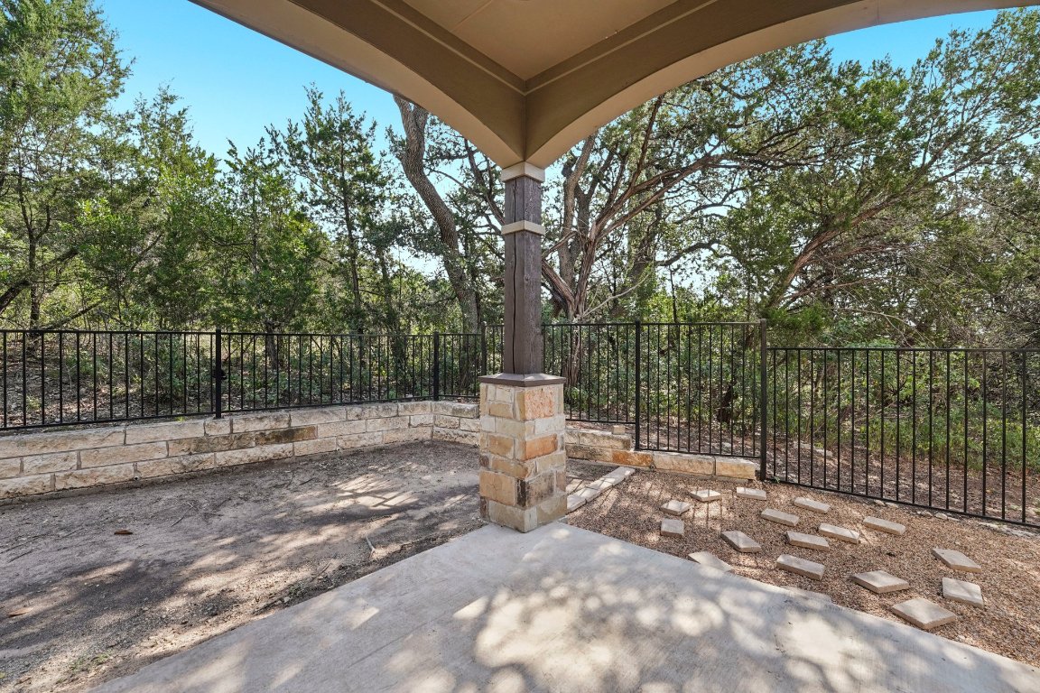 4301 Mansfield Dam Road, Unit 2101 Austin, TX 78734 - Photo 9 of 15 Step outside to your private covered patio, nestled against mature trees.