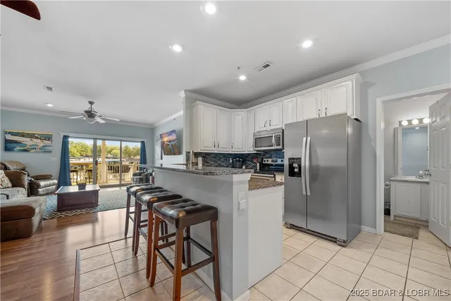 $359,900 | 216 Lakeview Resort Boulevard, Unit 1E, Sunrise Beach, MO 65079