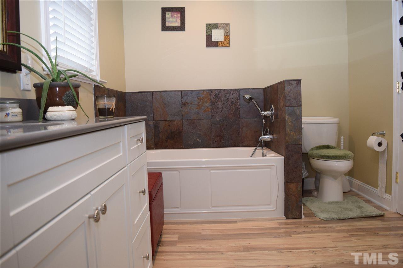 1987 Shotwell Road Clayton, NC 27520 - Photo 16 of 25 Multiroom master suite has his/hers bathrooms and closets.