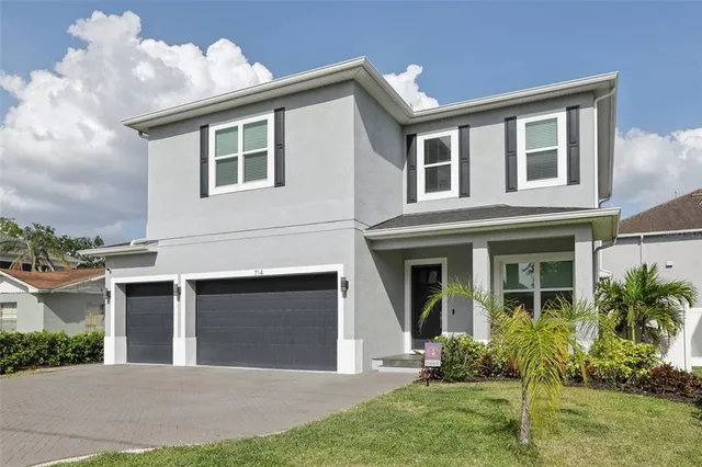 a view of entryway with wooden floor and stairs