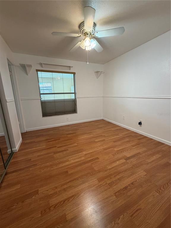 101 Gardenia Road Kissimmee, FL 34743 - Photo 13 of 24 wooden floor in an empty room