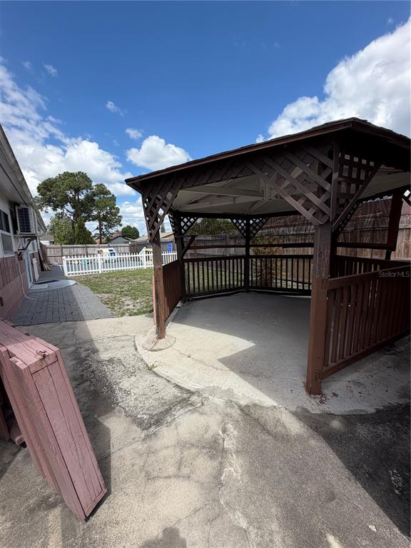 101 Gardenia Road Kissimmee, FL 34743 - Photo 22 of 24 a view of backyard with cabin