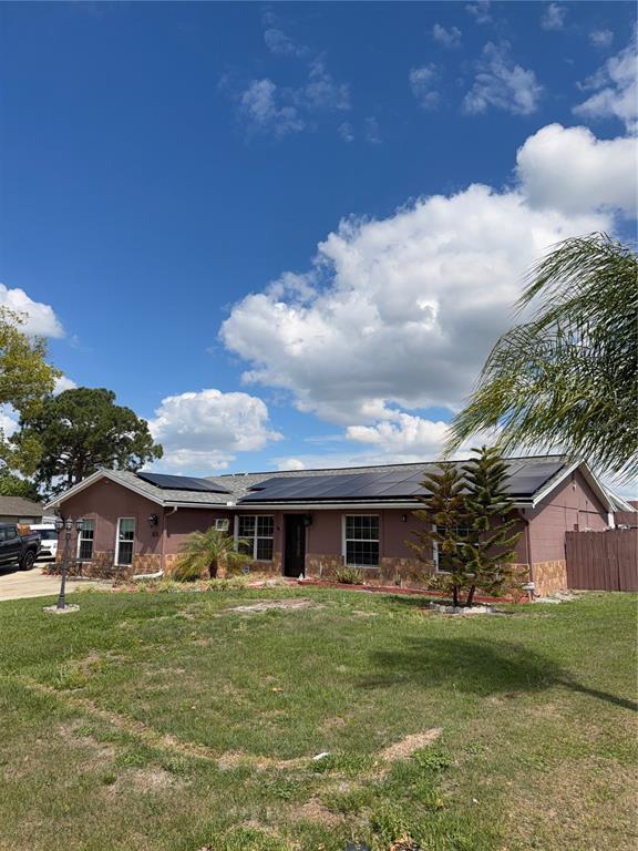 101 Gardenia Road Kissimmee, FL 34743 - Photo 24 of 24 a front view of house with yard and green space