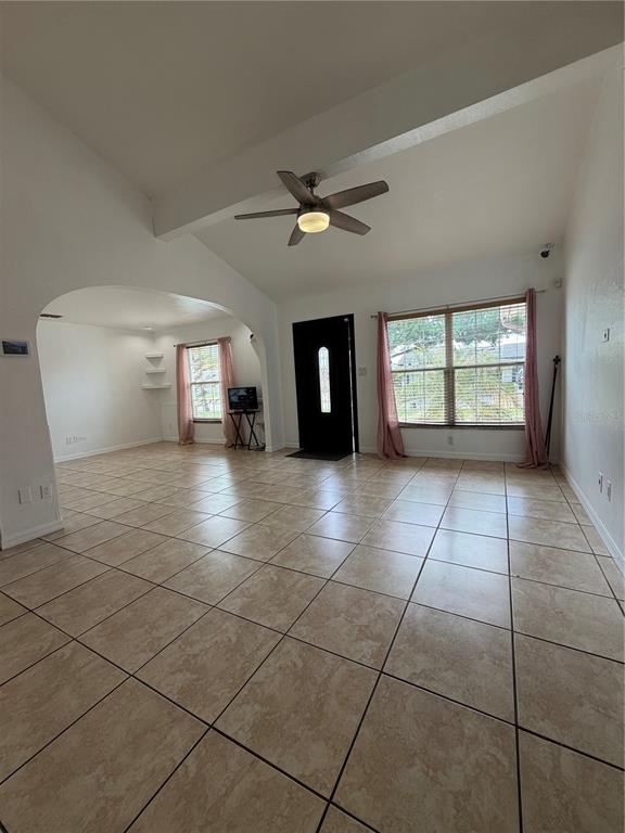 101 Gardenia Road Kissimmee, FL 34743 - Photo 3 of 24 a view of an empty room with a window