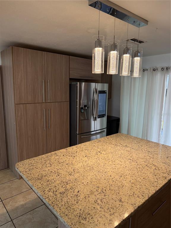 101 Gardenia Road Kissimmee, FL 34743 - Photo 6 of 24 a bedroom with a bed and wooden cabinets