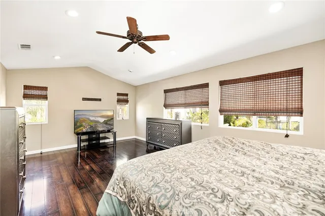 a living room with a bed furniture and a large window