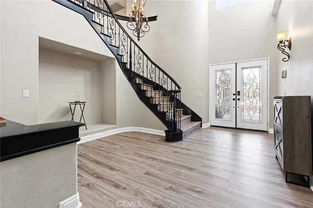 a view of an entryway with wooden floor