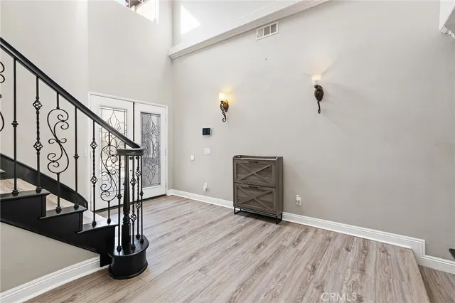a view of an entryway with wooden floor