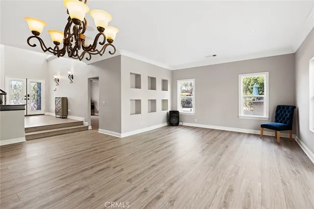 a view of a livingroom with furniture and a window