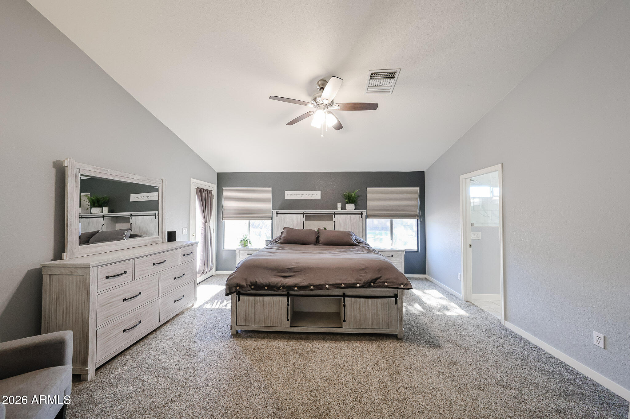 7733 West Rue De Lamour Peoria, AZ 85381 - Photo 25 of 62 a living room with furniture and a flat screen tv