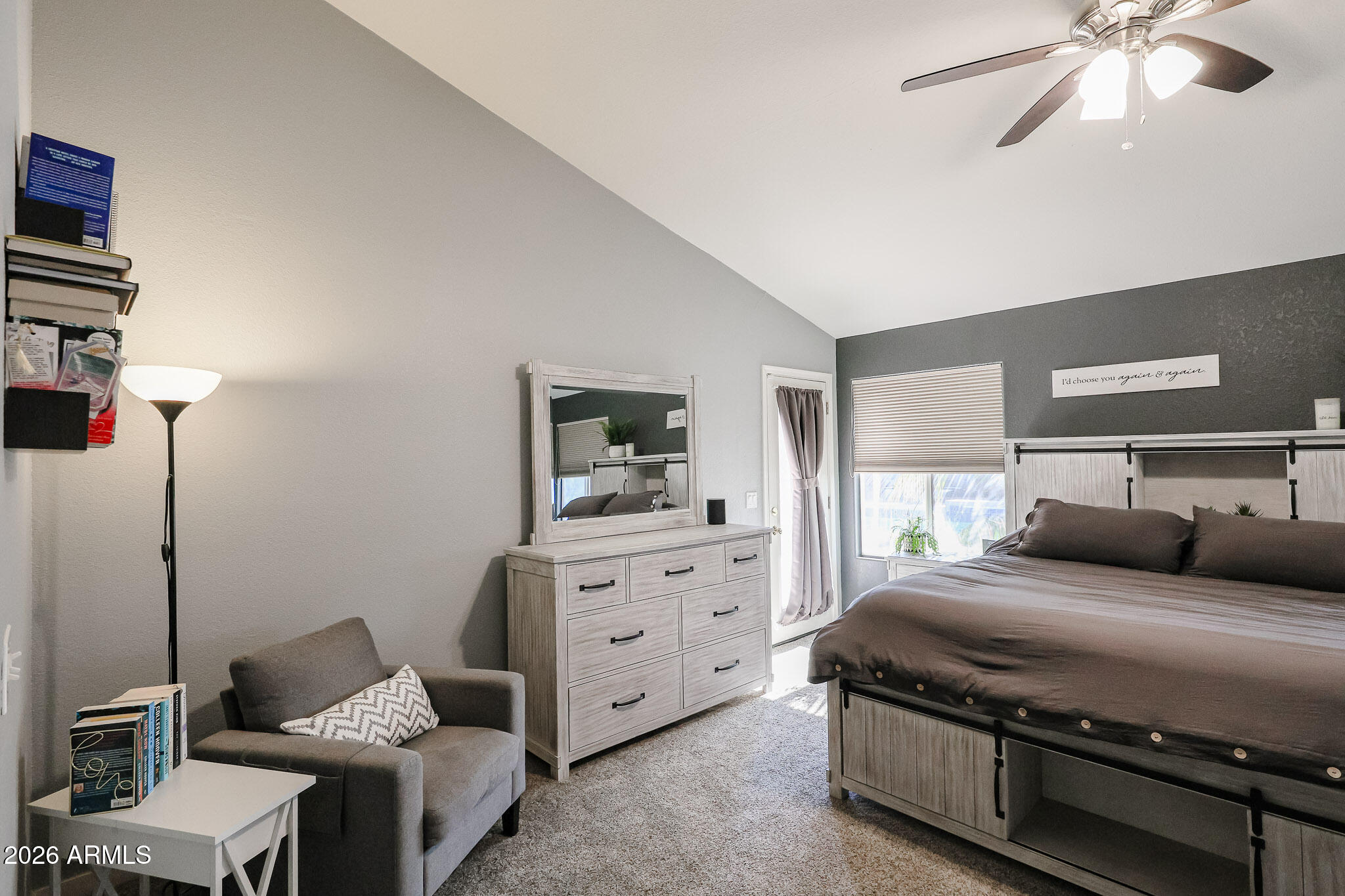 7733 West Rue De Lamour Peoria, AZ 85381 - Photo 27 of 62 a bedroom with a bed and wooden floor
