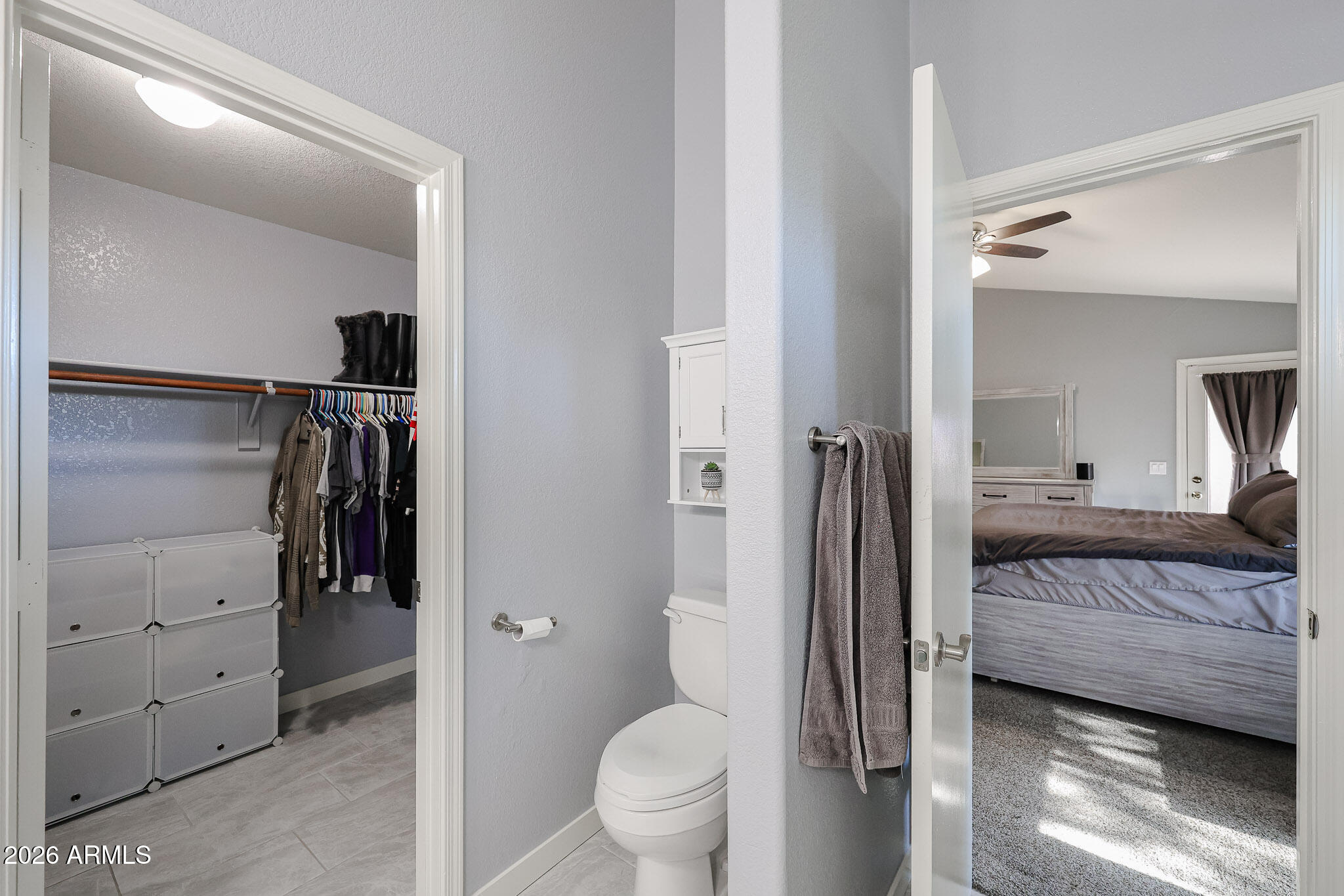 7733 West Rue De Lamour Peoria, AZ 85381 - Photo 35 of 62 a bathroom with a sink and a large mirror