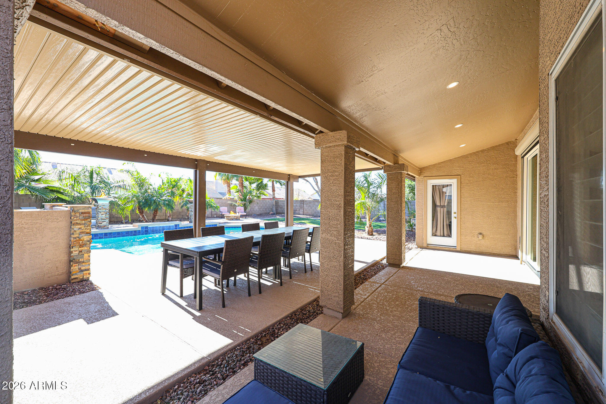 7733 West Rue De Lamour Peoria, AZ 85381 - Photo 42 of 62 a living room with furniture and a large window