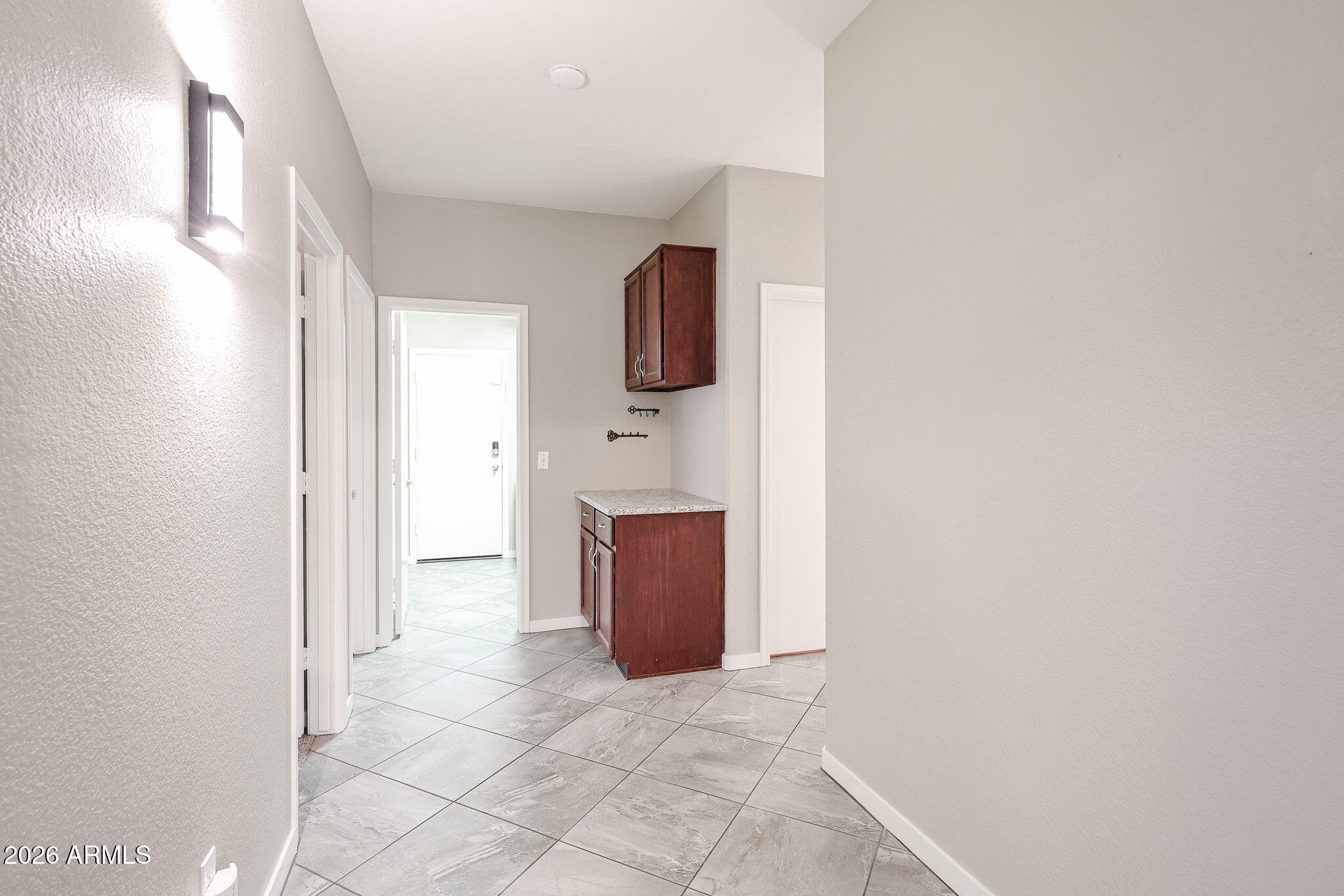 7733 West Rue De Lamour Peoria, AZ 85381 - Photo 59 of 62 en empty room with wooden floor