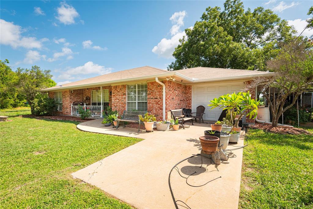 a view of a swimming pool with an outdoor seating