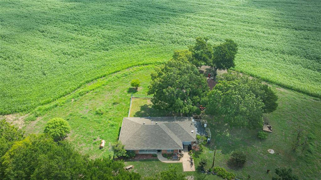 12097 Kyle Lane Blue Ridge, TX 75424 - Photo 9 of 13 an aerial view of residential house with outdoor space and trees all around