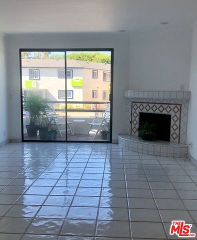 a room with washing machine and a fireplace