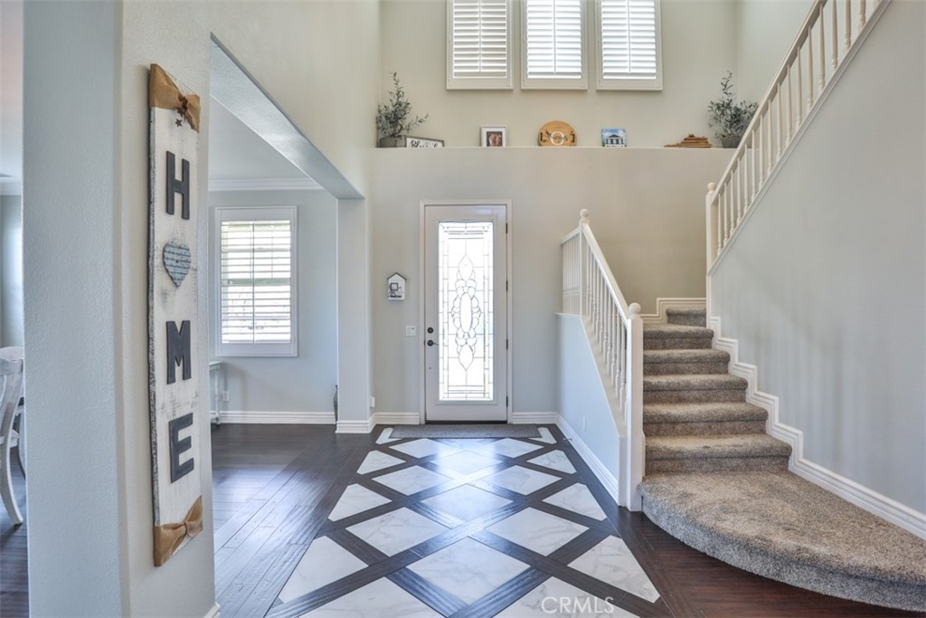 3250 Quartz Circle Corona, CA 92882 - Photo 11 of 68 a view of an entryway with wooden floor and stairs